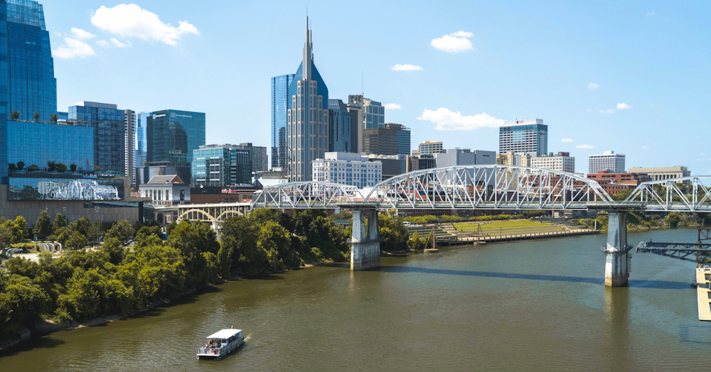 Downtown Nashville Skyline With Cumberland River And Bridge by Chad Morehead on Unsplash