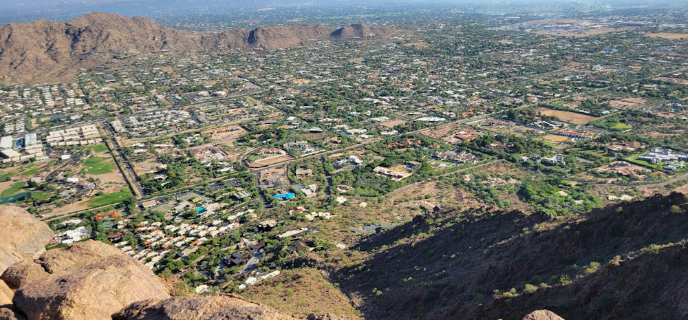 Aerial view of Camelback Mountain's rocky summit overlooking Arcadia and Paradise Valley neighborhoods in Phoenix by Christopher Hagens on Unsplash