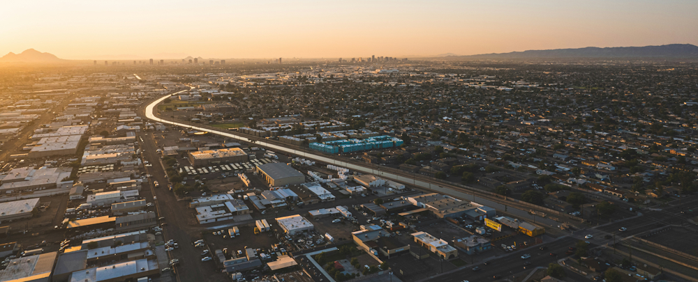 Road Winding Through Phoenix Neighborhoods at Sunset in Phoenix by Matthew Hamilton on Unsplash