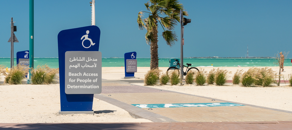 Accessible beach in the UAE with bilingual signage