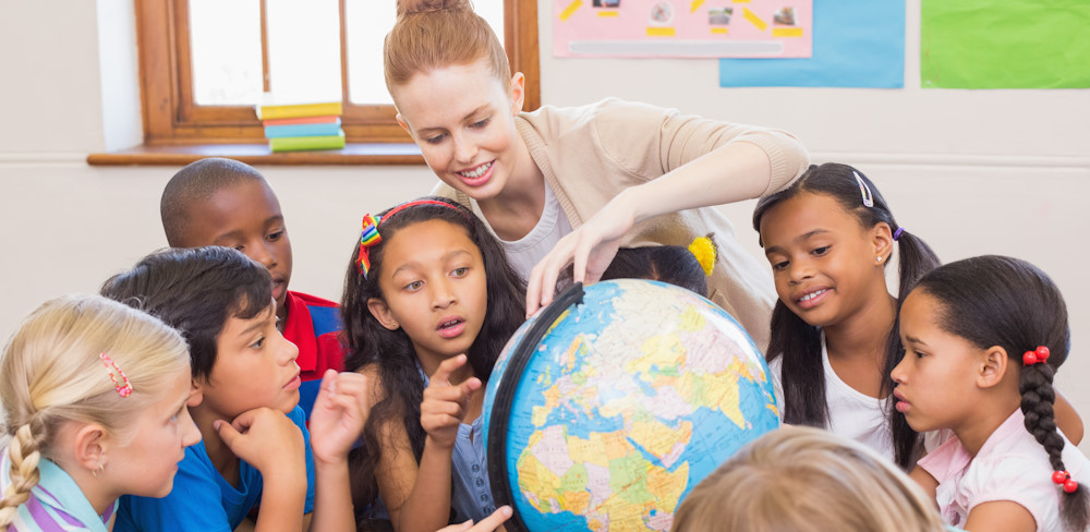 teacher with students and globe