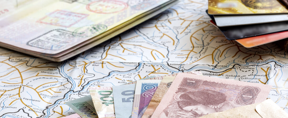 Passport, cash of various currencies, and map